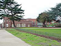 view from the east side with old front and new wing